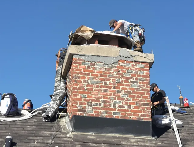 Storrs Chimney Sweep installing a custom chimney crown in Storrs, CT