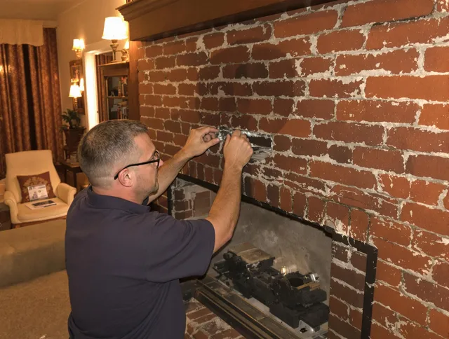 Storrs Chimney Sweep expert fixing a fireplace in Storrs, CT